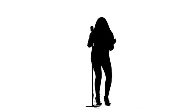 Singer performs her song of authorship. White background. Silhouette