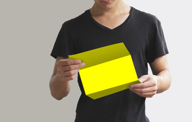 Man reading blank yellow flyer brochure booklet. Leaflet presentation. Pamphlet hold hands. Man...