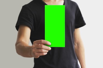 Man showing blank green flyer brochure booklet. Leaflet presentation. Pamphlet hold hands. Man show clear offset paper. Sheet template. Booklet design sheet display read first person