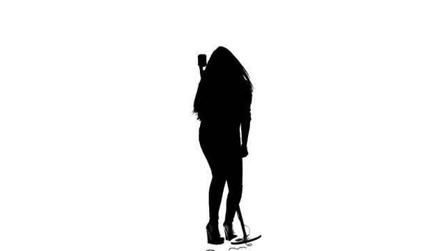 Vocalist performs incendiary songs in a microphone. White background. Silhouette