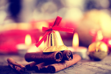 Christmas decoration with candles, christmas ball, ribbon, fir cone, tree, anice star, cinamon. Wooden Background For Copy Space. Vintage toned style