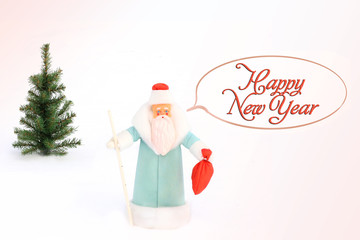 Santa Claus (Father Frost) and Christmas tree in the snow