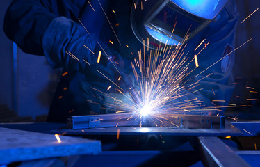 Welder erecting technical steel
