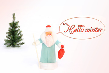 Santa Claus (Father Frost) and Christmas tree in the snow