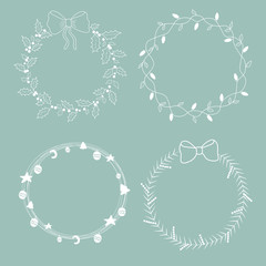 Christmas and New Year's collection of hand drawn wreaths. A frame with a copy for your text. Design of a card template or the invitation