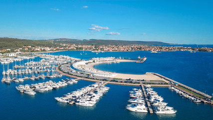 Aerial view of beautiful modern marine of Sukosan densely packed with sailing boats and yachts,...