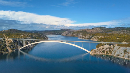 Aerial panorama view with bridge and sea around islands. Beautiful landscape surrounded with blue sea with bridge.