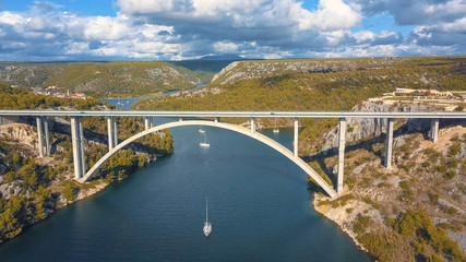 Fototapeta na wymiar Aerial panorama view with bridge and sea around islands. Beautiful landscape surrounded with blue sea with bridge.