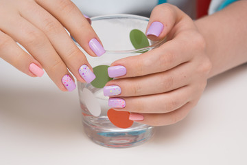 Beautiful natural nails and attractive manicure on women hands.