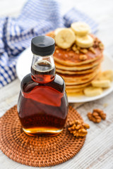 Maple syrup in glass bottle
