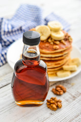Maple syrup in glass bottle