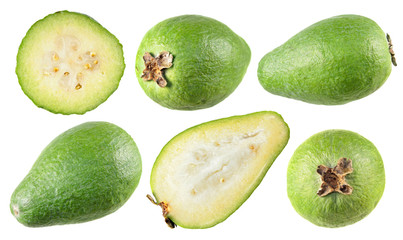 Unpeeled and cut in half green feijoa fruits isolated on white background