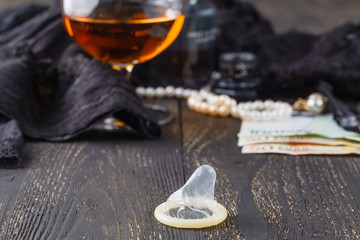 Underwear, cognac and money to symbolize the cost of sex