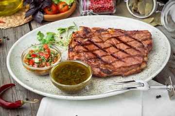Tenderloin steak on plate with sauce
