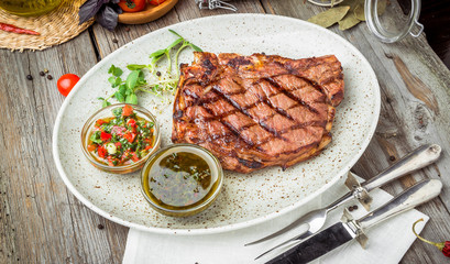 Tenderloin steak on plate with sauce