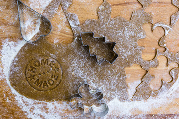 Christmas homemade gingerbreads on a wooden background.