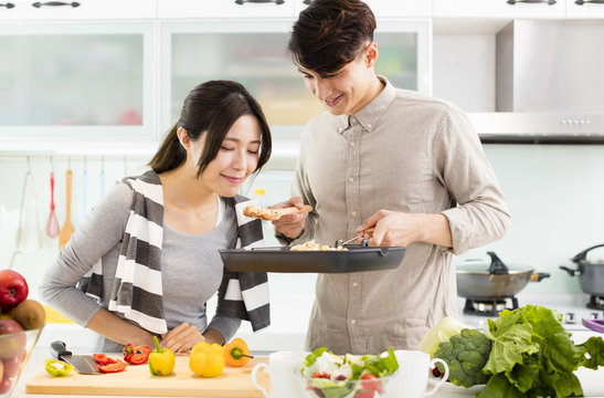 happy young Couple cooking in the kitchen
