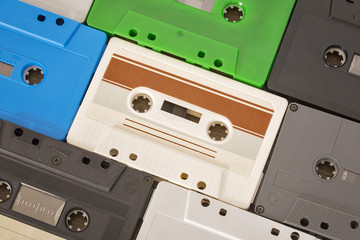 Retro colorful audio tapes and cases on the table