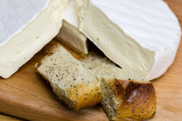 Fresh pastry with poppy seeds excellently paired with Camembert cheese brie .