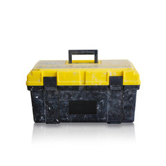 Dirty black box with a yellow lid for tools with a handle. Isolated on white background