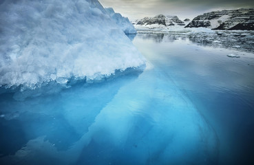 iceberg with above and underwater view