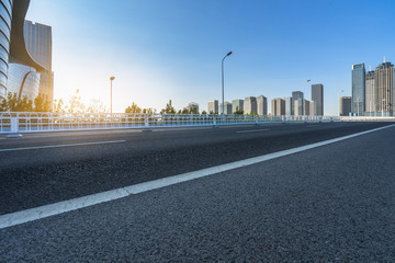 clean urban road and modern skyline background