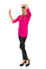 Fototapeta premium Beautiful Woman Is Shouting, Looking Away And Waving Hand