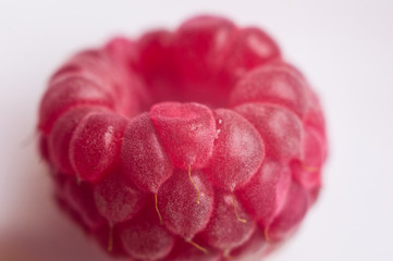 raspberries on a white saucer close up, macro photo