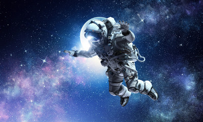 Obraz na płótnie Canvas Astronaut on space mission