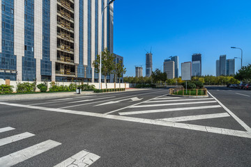 empty asphalt road front of modern buildings.