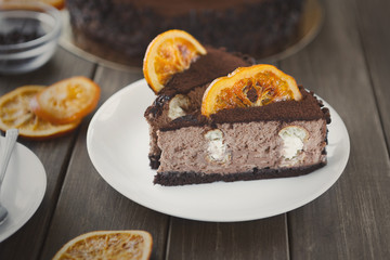 Chocolate cake with cream and profiterole