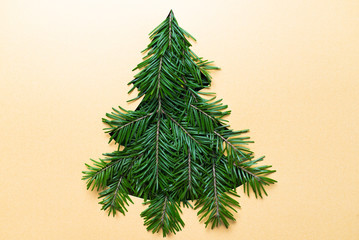 Christmas Tree shape cutout with branches. Christmas concept. Selective focus. Shallow DOF. Flat lay