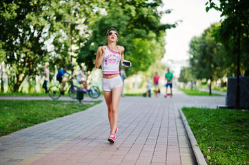 Sport girl wear on white shorts ans shirt running at park.