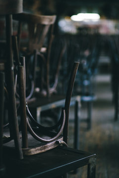 Chairs And Tables Stacked In A Closed Pub