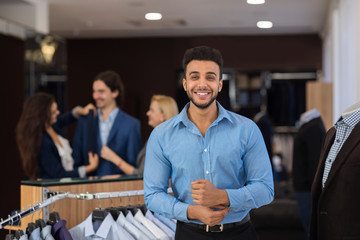Happy Smiling Hispanic Business Man Wearing New Shirt While Shopping In Luxury Clothes Store Or Suits Boutique Attractive Latin Male Menswear Concept
