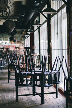 Chairs And Tables Stacked In A Closed Pub