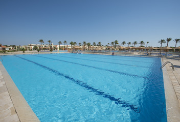 Large sports swimming pool in a luxury tropical hotel resort