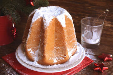 Delicious Christmas cake Pandoro with vanilla scented icing sugar traditiolly consumed at Christmas...