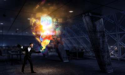 Businessman demonstrating magic . Mixed media