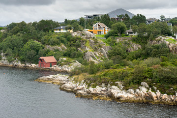 Fototapeta na wymiar Houses in Fjord in Norway