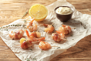 Bacon-wrapped shrimps on table