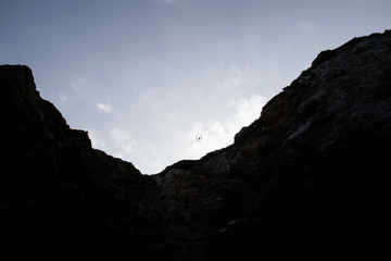 Drone flying over the mountains on a sunny day. 