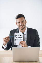 businessman pointing at notebook