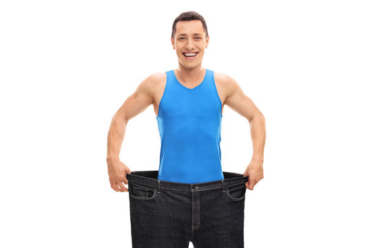 Happy guy in a pair of oversized jeans