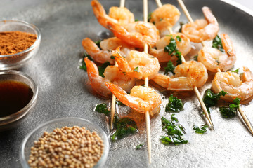 Skewers with delicious grilled shrimps, closeup