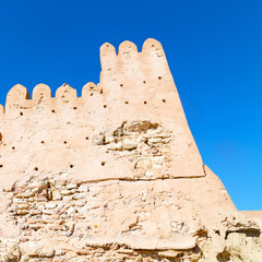 in oman    muscat    the   old defensive  fort battlesment sky and  star brick