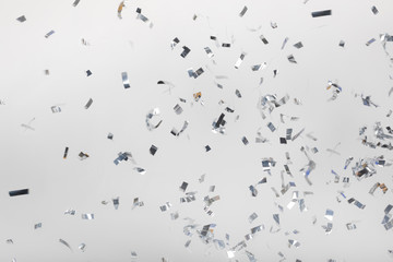 Falling silver confetti pieces - obrazy, fototapety, plakaty