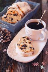 Stollen, traditional Christmas cake and cup of coffee. Toned image