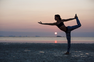 Fototapeta premium Beautiful girl practicing yoga