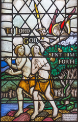 LONDON, GREAT BRITAIN - SEPTEMBER 17, 2017:  The Expulsion of Adam and Eve from Paradise on the stained glass  in church St. Barnabas by Martrin Travers 1945.